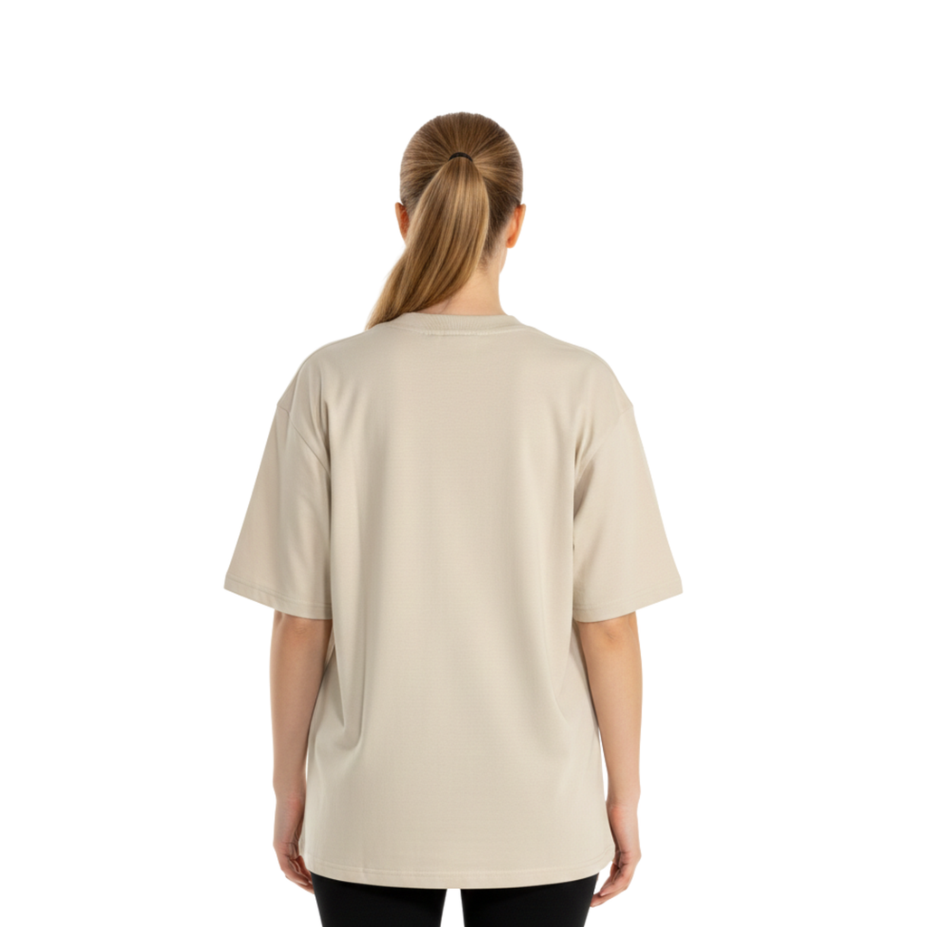 Oversized 220gsm heavyweight cotton graphic t-shirt in heather grey. Features a bold tri-color artistic streetwear design on the chest. Model is wearing a boxy fit, premium cotton tee with a modern drop-shoulder silhouette.