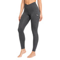 Madness Essential Leggings in Charcoal Grey featuring a crossover high-waisted waistband, side pocket, sculpting seams, and premium stretch fabric shown from front, side, and back.